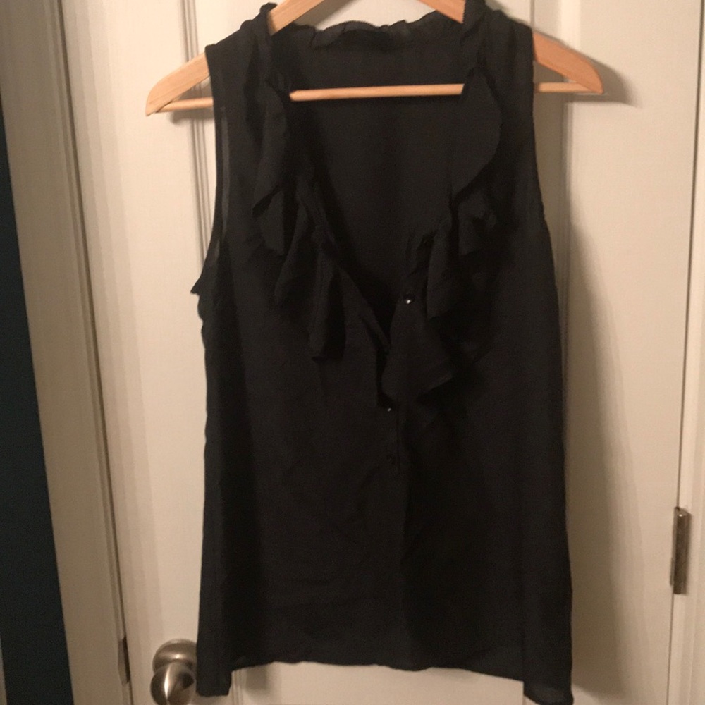 Black sleeveless blouse with with ruffle detail